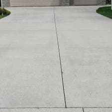 Grind-Shine-Soft-Washes-Janis-House-and-Pressure-Washes-Concrete-in-Hoagland 1